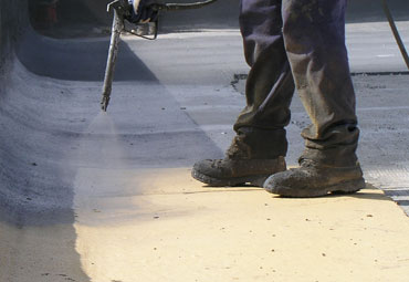 Coating systems over Madrid spray foam roof systems